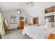 Main bedroom featuring high ceilings, dresser, and large windows offering beautiful views at 9061 N Rex Ln, Conifer, CO 80433