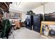 Organized storage room with safes, desk, tools and a view to the outside at 9061 N Rex Ln, Conifer, CO 80433