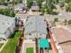 Birds-eye view showcasing a well-maintained home with a gray roof, surrounded by lush greenery and neighborhood charm at 3470 W Walsh Pl, Denver, CO 80219