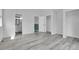 This spacious bedroom features wood floors, an ensuite bath and a closet at 3470 W Walsh Pl, Denver, CO 80219