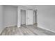 This neutral bedroom has wood floors and closet space at 3470 W Walsh Pl, Denver, CO 80219