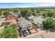 High-angle shot displaying the exterior featuring a fenced yard, ample parking and neighborhood charm at 3470 W Walsh Pl, Denver, CO 80219