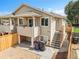 Charming two-story home with a private balcony and a well-maintained exterior, complemented by a tidy front yard at 3470 W Walsh Pl, Denver, CO 80219