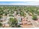 Picturesque aerial shot of a tree-lined neighborhood, showcasing community charm and accessibility at 3470 W Walsh Pl, Denver, CO 80219