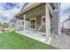 A backyard patio area with two hammocks, seating, and outdoor space at 10887 Endeavor Dr, Parker, CO 80134