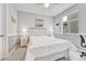 Cozy bedroom with a white wooden bed, nautical decor, and plenty of natural light at 10887 Endeavor Dr, Parker, CO 80134