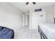 A simple bedroom with carpet, a ceiling fan, and a beanbag chair at 10887 Endeavor Dr, Parker, CO 80134