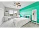 Bright bedroom with modern furniture, large windows, and colorful accent wall at 10887 Endeavor Dr, Parker, CO 80134