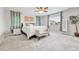 Lovely bedroom with accent wall, plush carpet, and decorative tree at 10887 Endeavor Dr, Parker, CO 80134