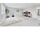 Spacious bonus room with carpeted floors and lots of natural light at 10887 Endeavor Dr, Parker, CO 80134