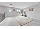 Large bonus room with carpet, tree, and large windows at 10887 Endeavor Dr, Parker, CO 80134
