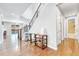 Spacious entryway with hardwood floors, staircase, and a glimpse of the backyard at 10887 Endeavor Dr, Parker, CO 80134