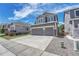 Attractive home featuring gray siding, a two-car garage, and a well-maintained driveway at 10887 Endeavor Dr, Parker, CO 80134