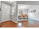 Welcoming foyer with hardwood floors leading to an elegant dining area at 10887 Endeavor Dr, Parker, CO 80134