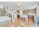 Bright kitchen features dark cabinets, granite countertops, stainless steel appliances and island with bar seating at 10887 Endeavor Dr, Parker, CO 80134