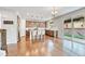 Open concept kitchen with stainless steel appliances, large island, and sliding glass doors to the backyard at 10887 Endeavor Dr, Parker, CO 80134