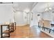 Open-concept living space featuring hardwood floors and a view of the dining area at 10887 Endeavor Dr, Parker, CO 80134