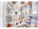 Organized walk-in pantry with wire shelving, filled with neatly arranged food containers and supplies at 10887 Endeavor Dr, Parker, CO 80134