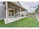 Patio featuring a manicured lawn, covered space with a hammock, and a beautiful outdoor setting at 10887 Endeavor Dr, Parker, CO 80134