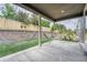 Covered patio with a stone retaining wall, hammocks, and a cozy seating area for relaxation at 10887 Endeavor Dr, Parker, CO 80134