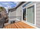 Back deck features wood flooring, metal railings, and sliding glass door for easy indoor-outdoor living at 364 Willowick Cir, Highlands Ranch, CO 80129