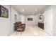 Finished basement features tile floor, white walls and accents and a leather sofa at 364 Willowick Cir, Highlands Ranch, CO 80129