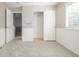 Carpeted bedroom with wainscotting and closet at 364 Willowick Cir, Highlands Ranch, CO 80129