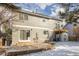 Two-story home showcasing sliding glass doors, patio, balcony, shed, and gray siding at 364 Willowick Cir, Highlands Ranch, CO 80129