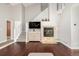 Inviting living room featuring hardwood floors, a fireplace, and staircase at 364 Willowick Cir, Highlands Ranch, CO 80129