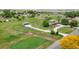 Scenic aerial view of property featuring large grassy acreage, outbuildings and mature trees at 15545 Lipan St, Broomfield, CO 80023