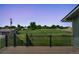 Relaxing back deck area overlooking a grassy field with white fence and barn at 15545 Lipan St, Broomfield, CO 80023