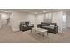 Finished basement featuring neutral walls, carpet, contemporary furniture, and modern decor at 15545 Lipan St, Broomfield, CO 80023