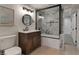 Modern bathroom features a single vanity and a shower with marble-look tiles at 15545 Lipan St, Broomfield, CO 80023