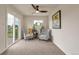 Cozy bedroom featuring patterned chairs, a ceiling fan, and a peaceful ambiance at 15545 Lipan St, Broomfield, CO 80023