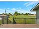 Wooden deck features black metal railings and provides panoramic views of the surrounding green space at 15545 Lipan St, Broomfield, CO 80023