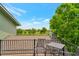 Deck with outdoor seating offers panoramic views, framed by a backdrop of trees and blue sky at 15545 Lipan St, Broomfield, CO 80023