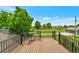Outdoor deck with black metal railing and seating, offering stunning views of the surrounding landscape at 15545 Lipan St, Broomfield, CO 80023