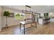 Open dining area with hardwood floors and view of kitchen, perfect for Gathering meals and entertaining at 15545 Lipan St, Broomfield, CO 80023