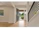Bright entryway features hardwood floors, an open door, and a staircase, creating an inviting atmosphere at 15545 Lipan St, Broomfield, CO 80023
