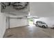 A spacious white garage features room for one car and ample storage at 15545 Lipan St, Broomfield, CO 80023