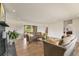Spacious living room with a fireplace, hardwood floors, and sliding doors to the backyard at 15545 Lipan St, Broomfield, CO 80023