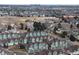 Aerial view of townhouses with mountain views in background at 9711 W Indore Dr, Littleton, CO 80128