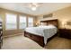 Spacious primary bedroom with large bed, nightstands, and ample natural light at 9711 W Indore Dr, Littleton, CO 80128