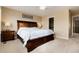 King-size bed in spacious bedroom with large closet and window at 9711 W Indore Dr, Littleton, CO 80128