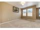 Spacious bedroom with neutral decor, carpet, and window with blinds at 9711 W Indore Dr, Littleton, CO 80128