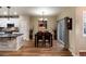 Bright dining area with hardwood floors and access to a patio at 9711 W Indore Dr, Littleton, CO 80128