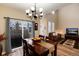 Open concept dining area featuring hardwood floors and a view to the living room at 9711 W Indore Dr, Littleton, CO 80128