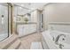 Spa-like bathroom featuring a large soaking tub, double vanity, and shower at 2 Garfield St # B, Denver, CO 80206