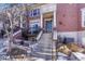 Townhouse entry with steps leading to the front door and a small patio area at 2 Garfield St # B, Denver, CO 80206