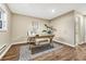 Charming home office with wood desk, flooring, and large window at 2 Garfield St # B, Denver, CO 80206